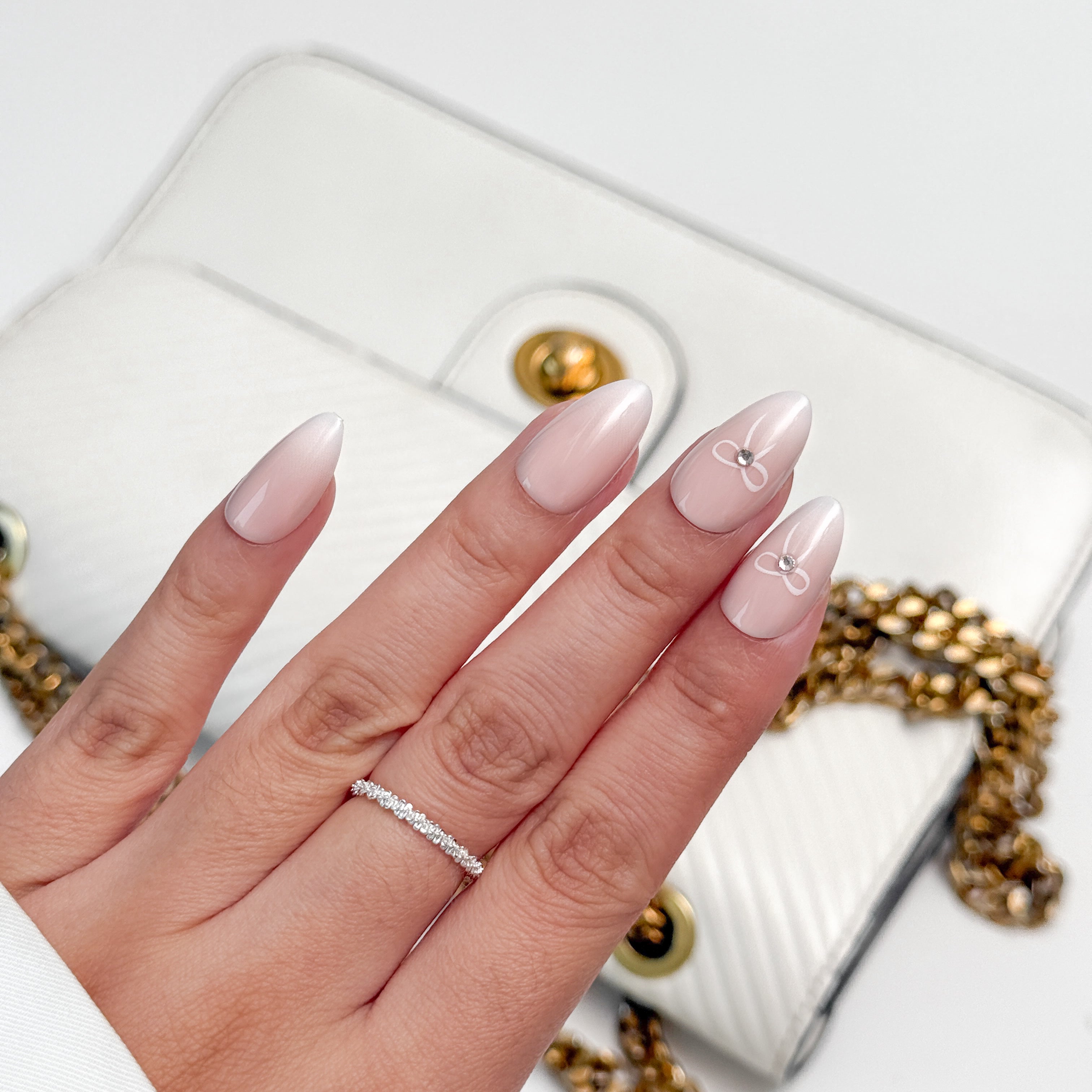 Pink Belle | Salon Quality Press-on Nails Kit - Short Almond Ombre Pink with Bow Accents