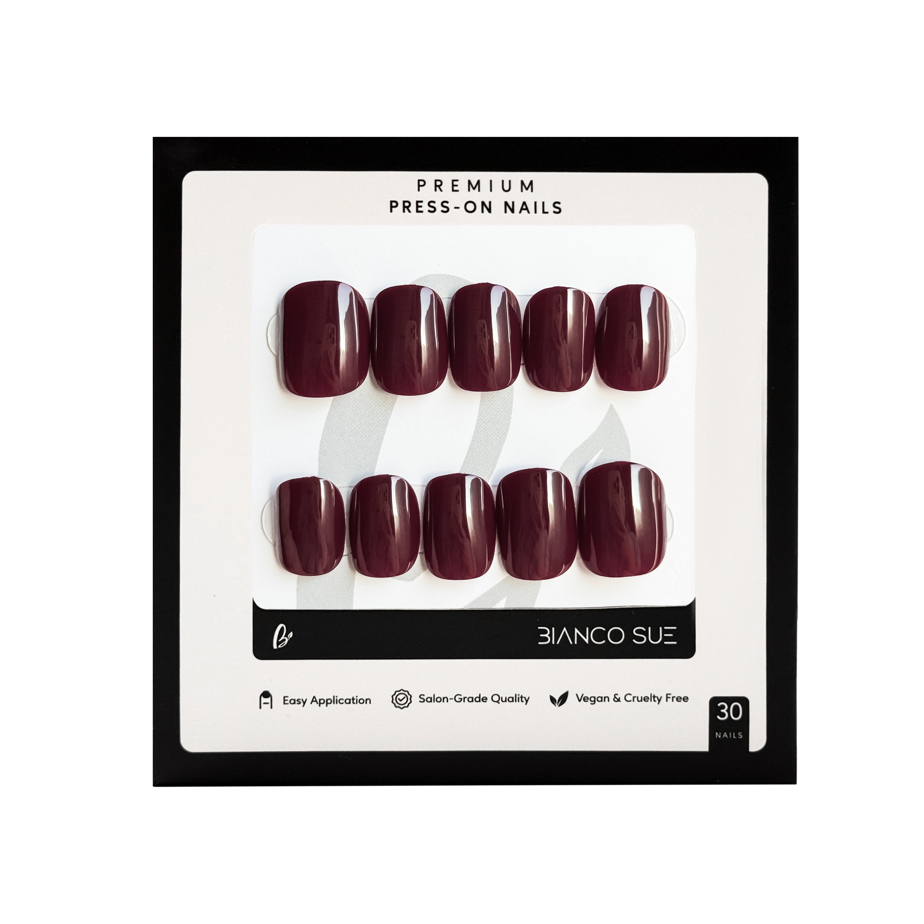 Merlot Noir extra short squoval press-on nails kit in dark red, offering a bold and luxurious manicure perfect for a statement look.